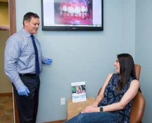 Dr Gordon greets an adult orthodontic patient